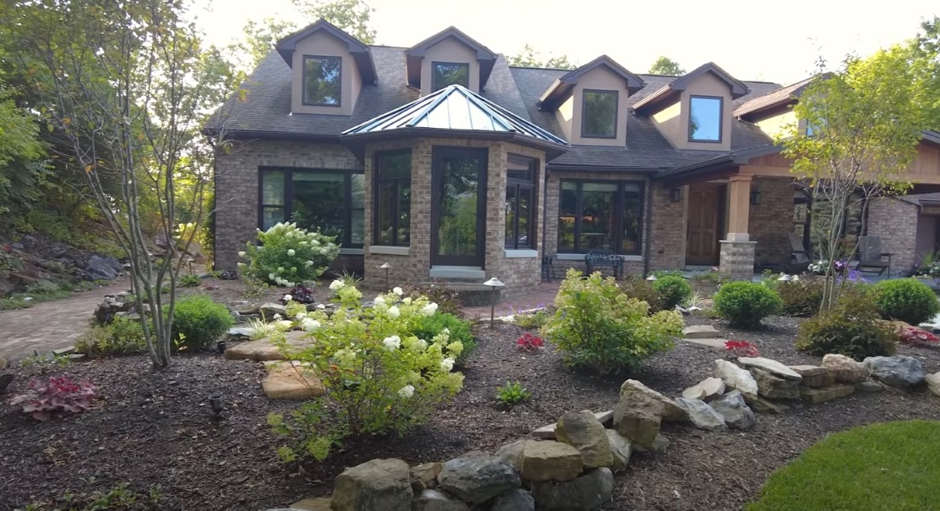 Professional landscape design with beautiful garden beds and stone pathways in Portsmouth, VA